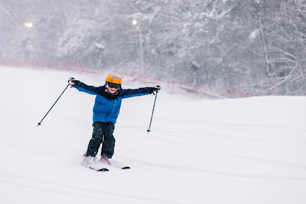 A skier at Berkshire East Charlemont Massachusetts partaking in winter sports. In the scene