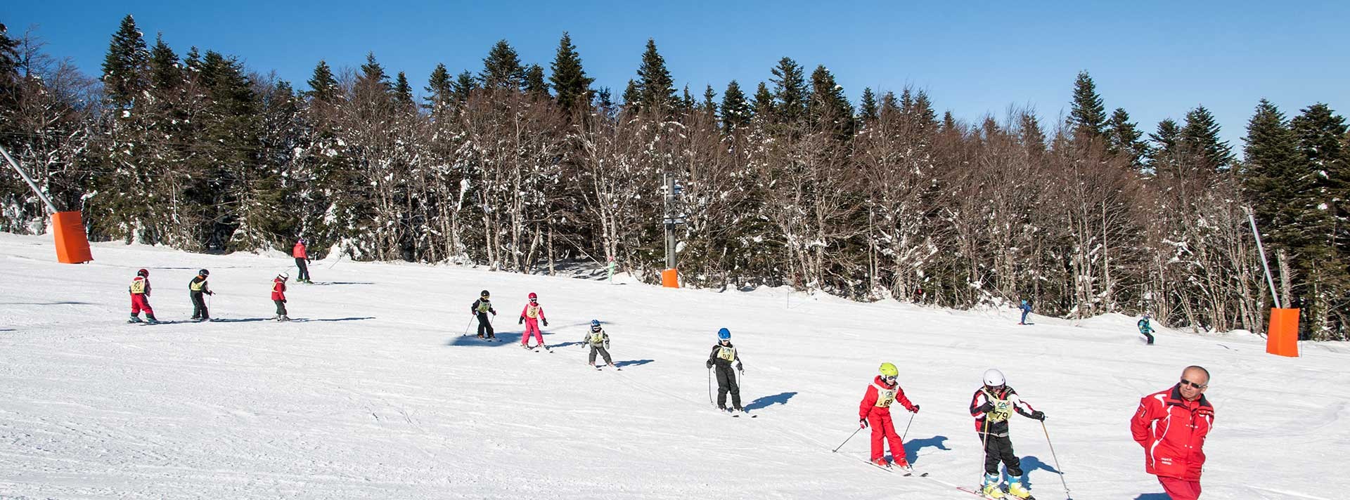 Chalmazel in France - a group of people skiing down a snowy slope.
