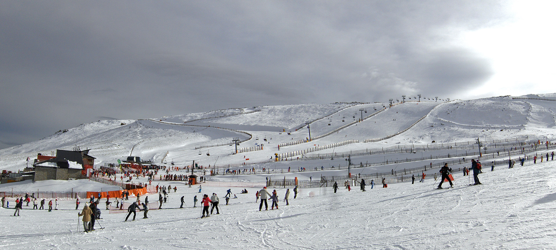 Ski Sierra Bejar Covatilla in Spain - a group of people skiing down a snowy slope.