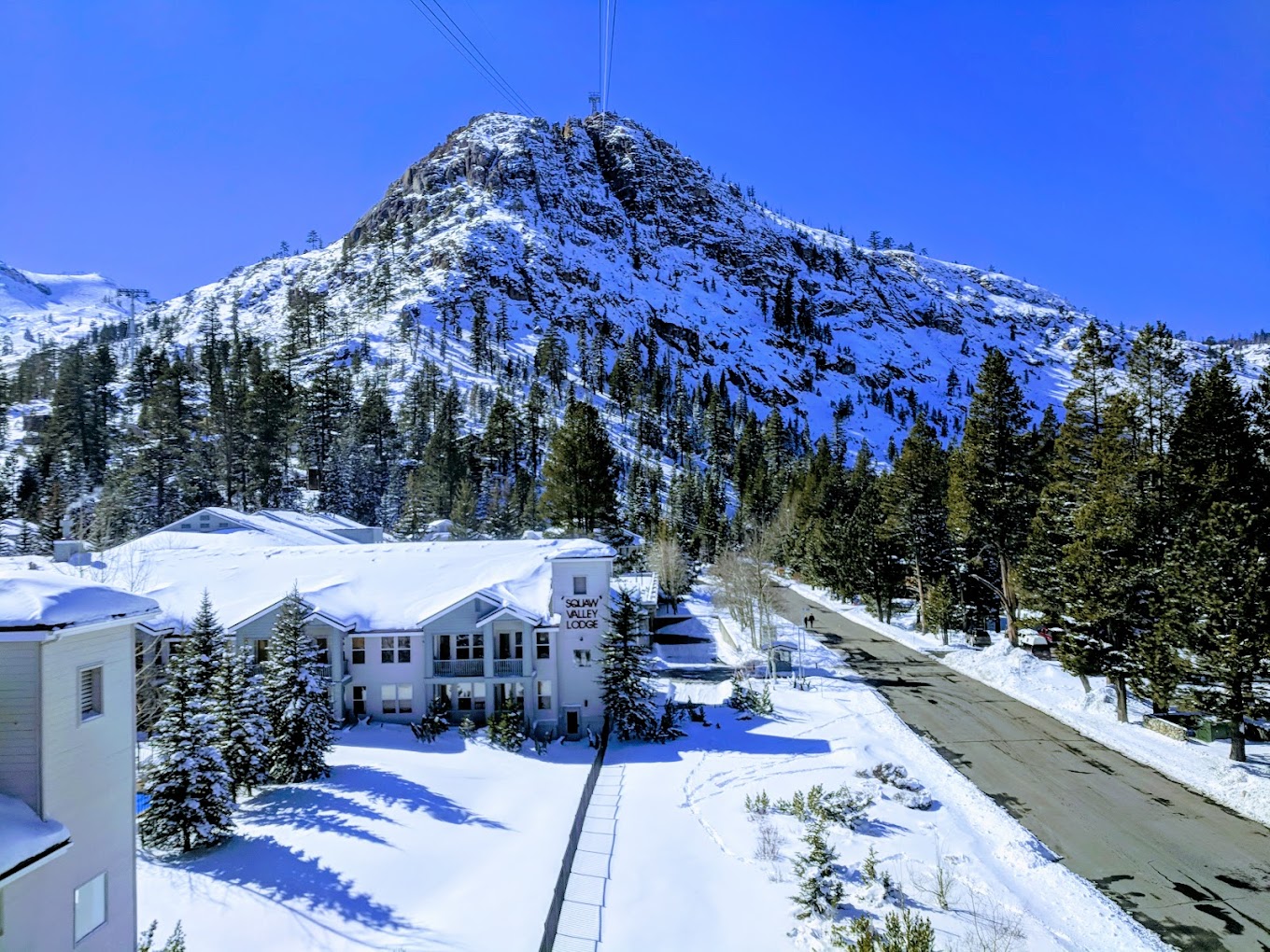 Ski resort at Palisades Tahoe, Lake Tahoe, showing stunning winter scenery perfect for winter sports activities.