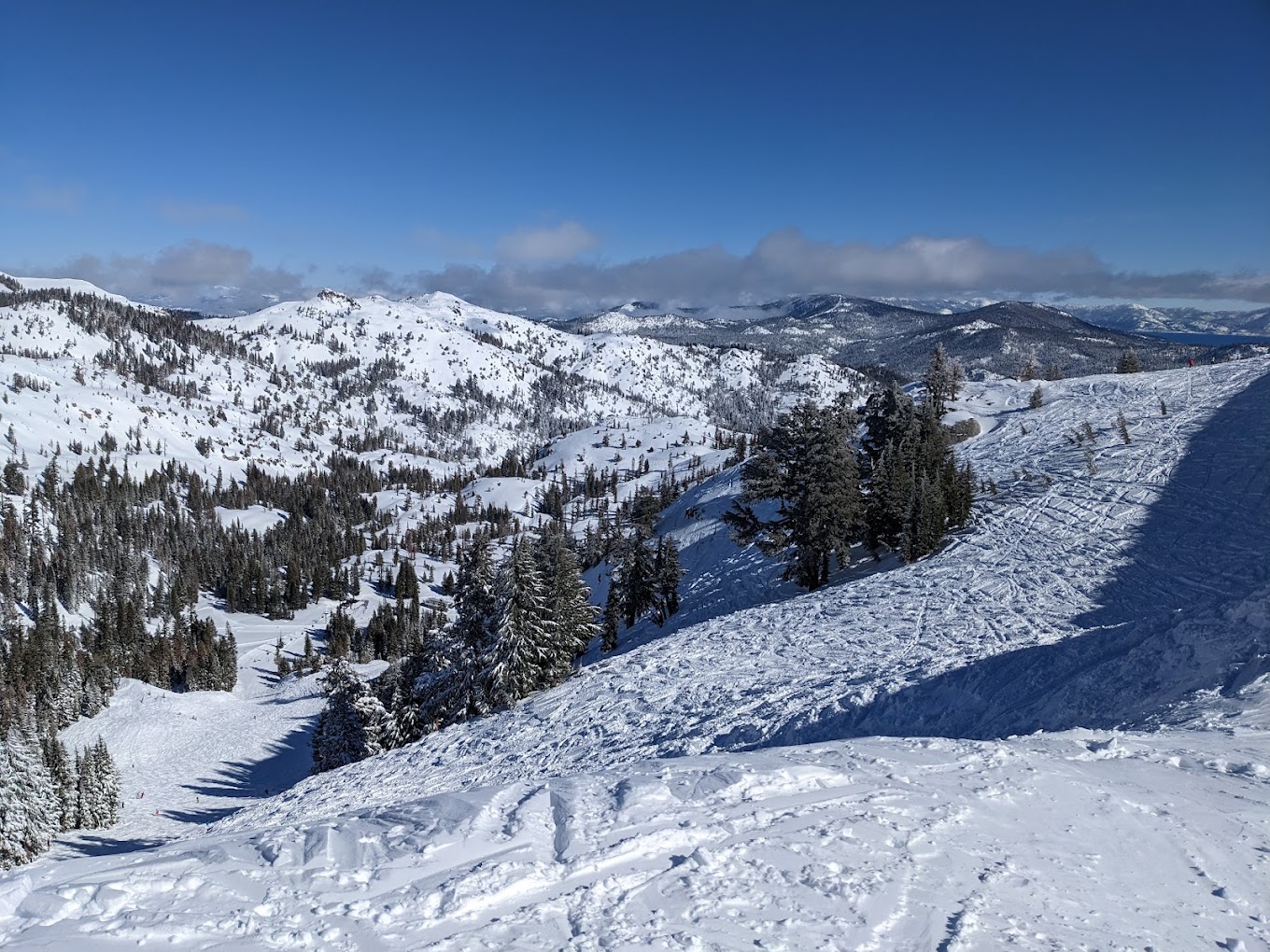 A vibrant winter sports scene at Palisades Tahoe Ski Resort in California, USA, showcasing snow-covered slopes, a ski lift, and a captivating winter scenery.