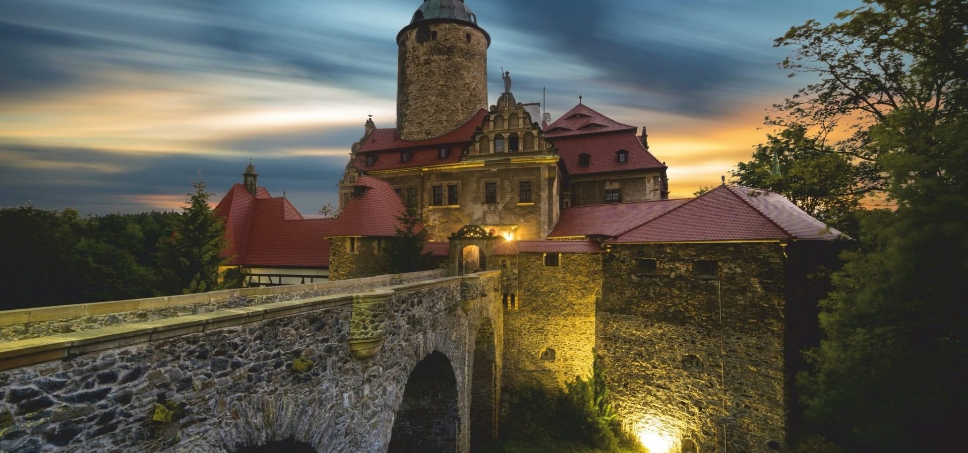 Szklarska Poręba – Szrenica in Poland - a castle with a red roof and a stone wall.