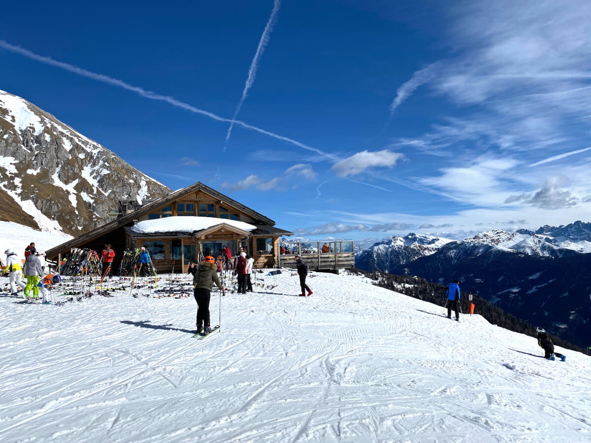 Ski Center Latemar in Italy - a group of people skiing down a snowy slope.